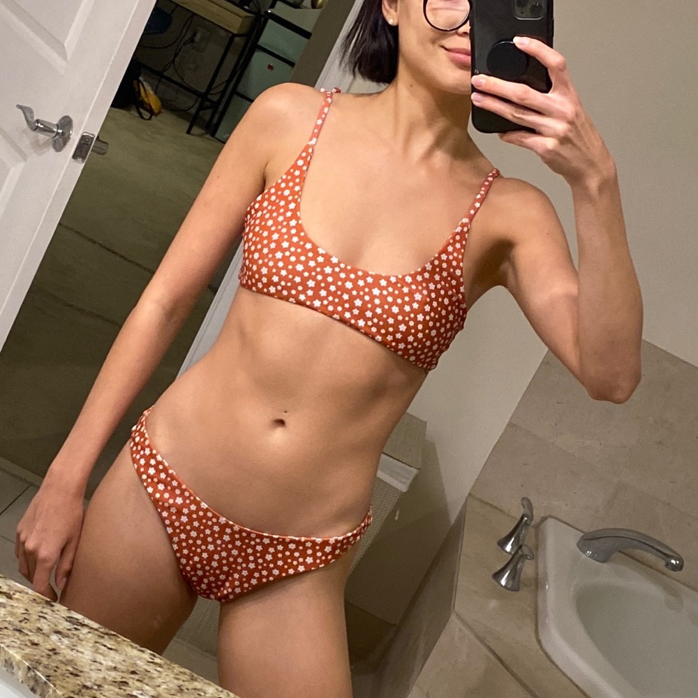 Swimsuit set. Burnt orange with white flowers. Top xsmall and bottom small.